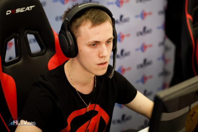 a young man wearing headphones in front of a computer